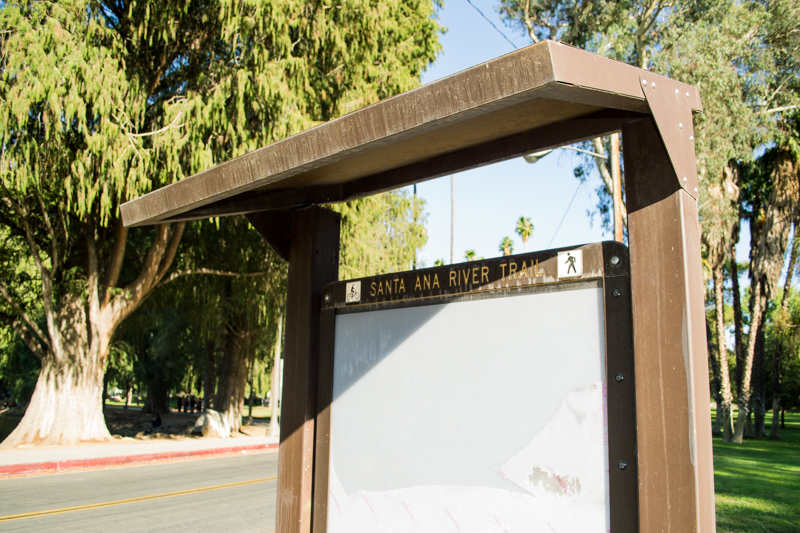 An old and outdated Santa Ana River Trail sign.